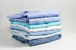 Stack of folded laundry from wash-and-fold service.