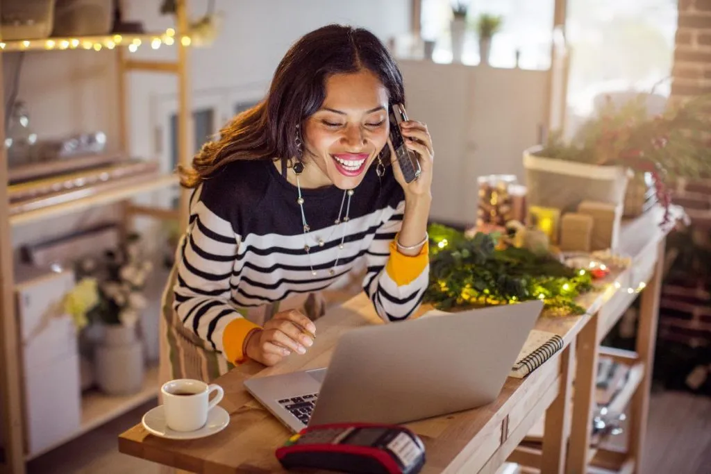 Online Order Printing Solutions: Labels & Receipts for Food Delivery Apps 1 Woman on the phone ordering from online.
